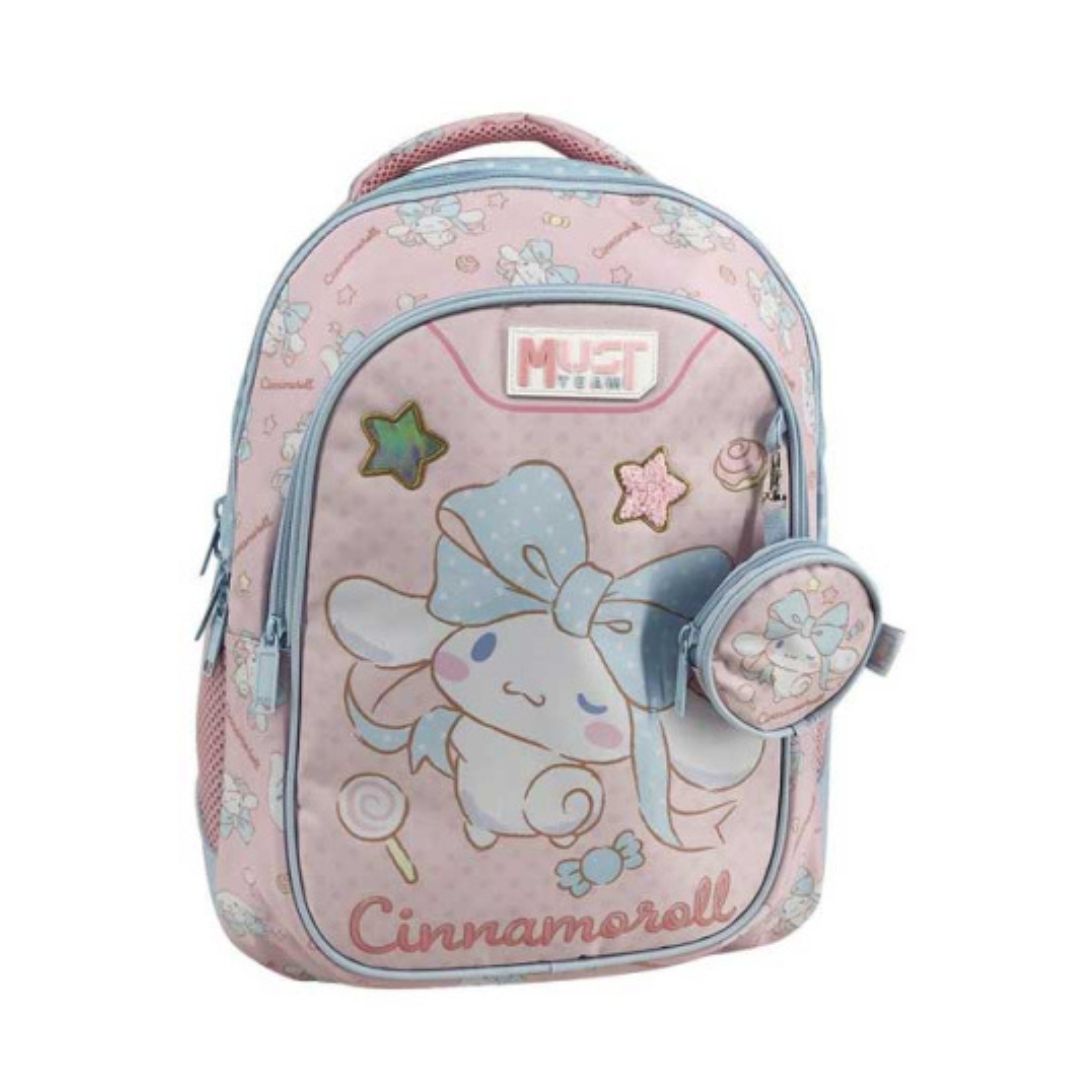 A pink Cinnamoroll school backpack with a matching zippered pouch, featuring a light blue bow design, pastel star and candy motifs, and a 'MUST TEAM' logo patch on the front.