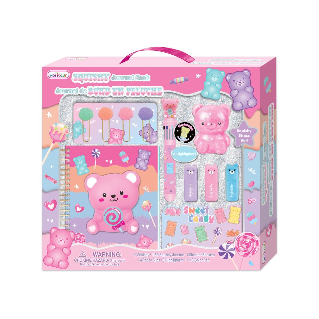 A children's craft kit in retail packaging, featuring a pink bear-themed box with a handle. The kit includes a glittery notebook, colorful sponges, paintbrushes, stickers, and candy-shaped accessories visible through a clear window on the front of the box.