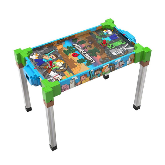 A Minecraft-themed children's air hockey table with a colorful printed game board, green corner bumpers, blue side panels, and silver legs on a plain white background.