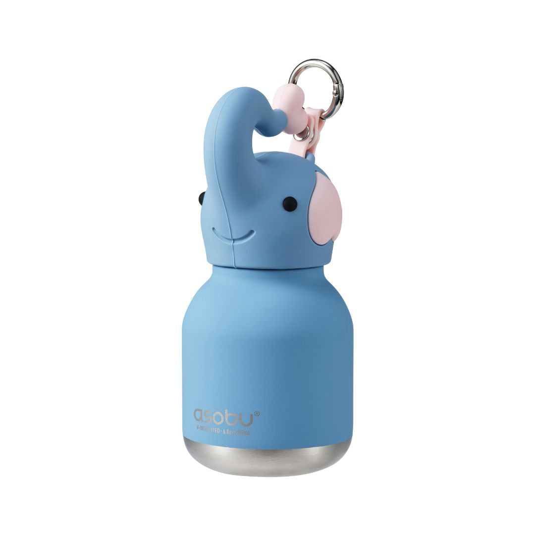 A light blue insulated bottle shaped like a smiling elephant, with a pink ear, black eyes, a silver metal ring, and a stainless steel base, shown on a plain white background.