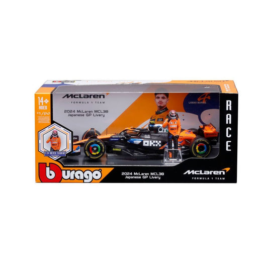 A boxed toy model of a McLaren MCL38 Formula 1 car, shown in its retail packaging against a plain white background. The packaging features orange, black, and white branding, including the 'Burago' logo and 'McLaren' branding.