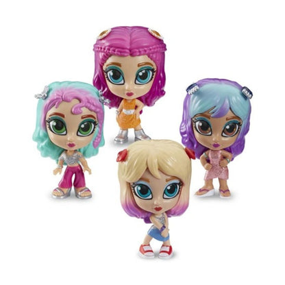 Four small doll figures with oversized eyes and colorful hair, arranged on a plain white background. The dolls have pink, teal, purple, and blonde hair, and are dressed in bright outfits.