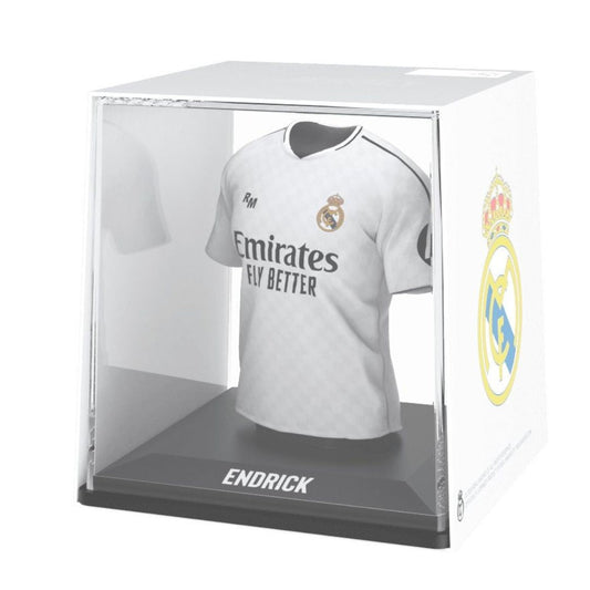 Real Madrid jersey in a clear display case with visible branding.