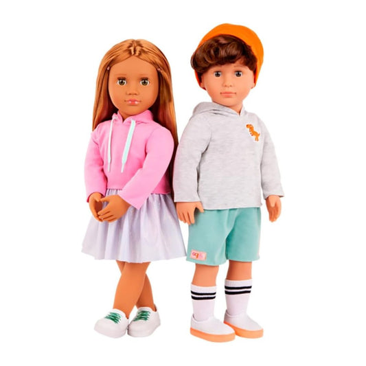 Two 18-inch style dolls standing side by side on a plain white background. The doll on the left has long light brown hair and wears a pink hoodie with a white drawstring and a light lavender skirt.