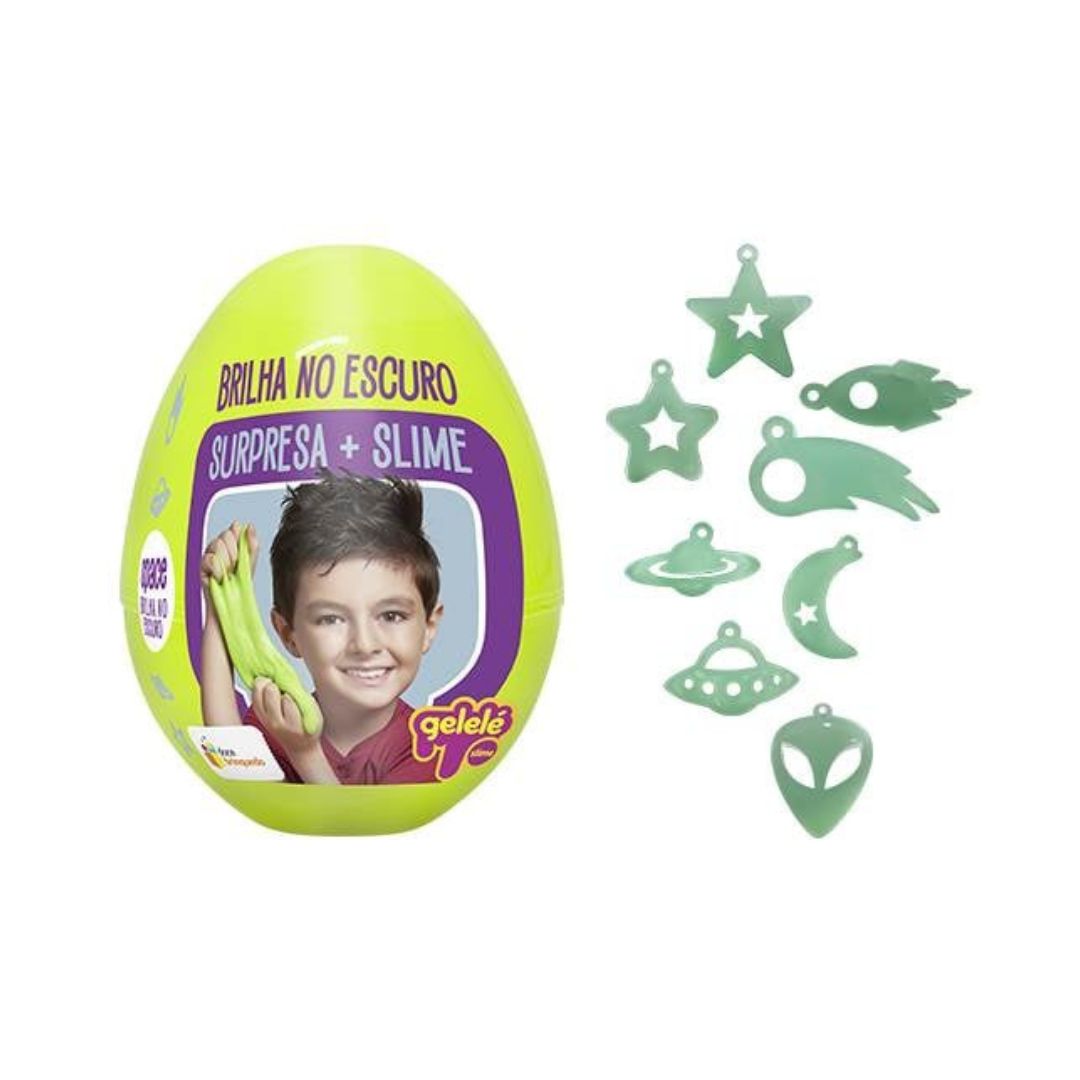 Geleç surprise slime egg toy in bright lime green with a purple label showing a child and the text 'Surpresa + Slime', alongside several mint green silicone slime shapes including stars, moons, aliens, and spaceships on a white background.
