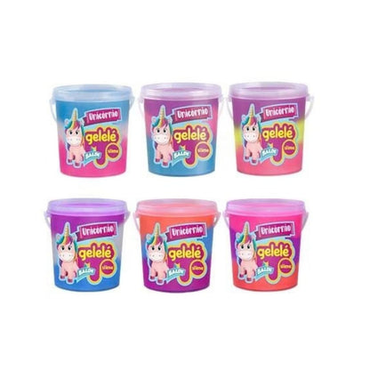 Six small plastic buckets of geélé makeup in different unicorn-themed colors, arranged in two rows of three on a plain white background.