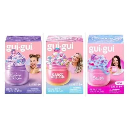 Three slime kits in retail packaging lined up side by side on a white background. The kits are branded 'gui-gui' and feature different colored slime jars and boxes: Galaxy Morgan in purple, Grace Williams in pink and blue, and Salish in pink and blue.