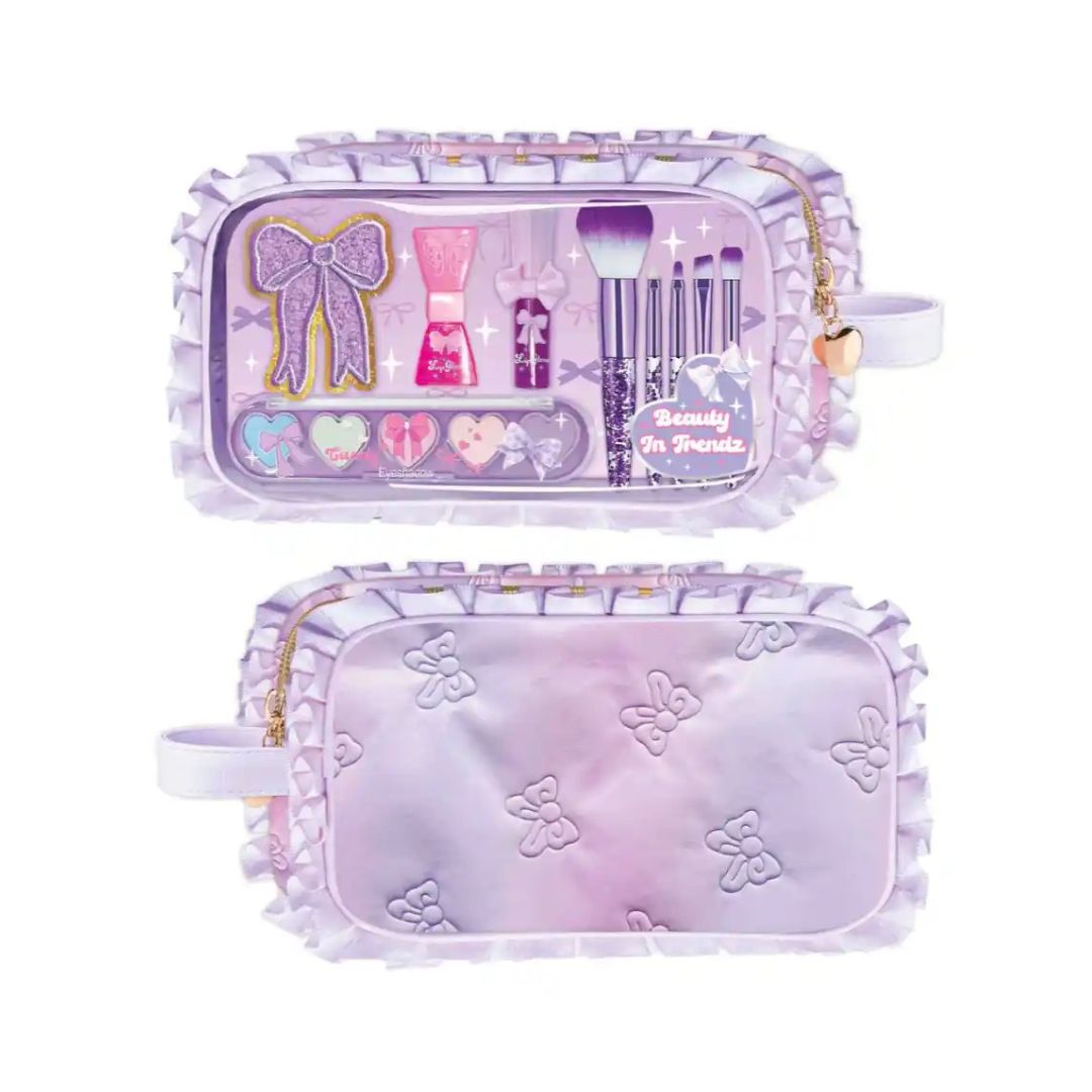 A lavender purple makeup bag shown from both the front and back. The front features a clear window displaying a miniature makeup set with a glittery bow, brush applicators, and heart-shaped items, along with a gold zipper and a small gold bell.