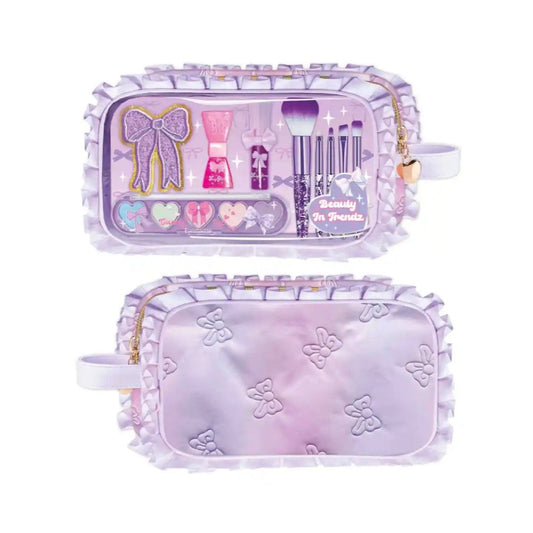 A lavender purple makeup bag shown from both the front and back. The front features a clear window displaying a miniature makeup set with a glittery bow, brush applicators, and heart-shaped items, along with a gold zipper and a small gold bell.