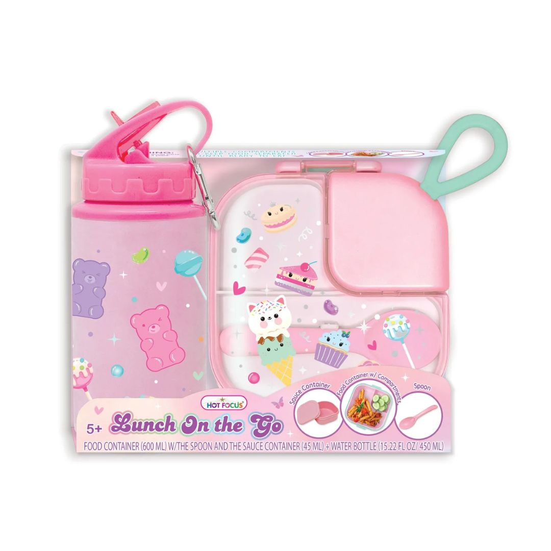 A pink and purple 'Lunch On the Go' water bottle and lunch box set by Wet Focus, featuring cartoon gummy bear and ice cream illustrations, shown on a white background.