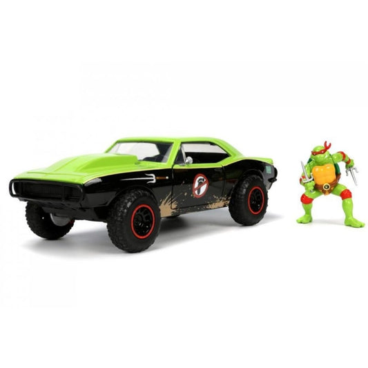 A green and black muscle car toy with red-rimmed wheels, shown next to a green Teenage Mutant Ninja Turtle action figure on a clean white background.