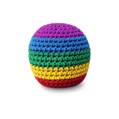 A round, hand-crocheted pouf or ottoman featuring horizontal rainbow stripes of purple, blue, green, yellow, and red on a white background.