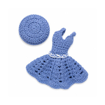 A crocheted doll outfit set in dusty blue, including a short dress with a braided white belt and a matching round hat, displayed on a clean white background.