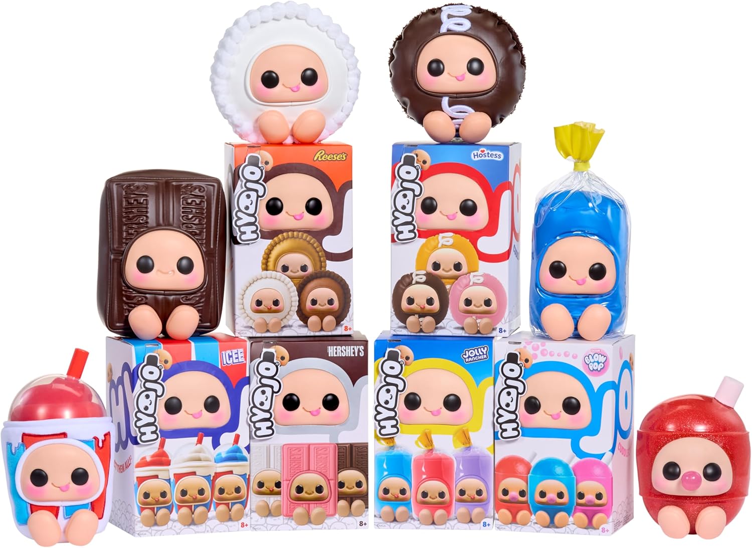 A collection of cute, chibi-style vinyl figures and toy boxes arranged together on a plain white background. The figures are designed to look like chocolate, candy, ice cream, and other sweet treats, with large cartoon eyes and pastel colors.