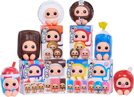 A collection of cute, chibi-style vinyl figures and toy boxes arranged together on a plain white background. The figures are designed to look like chocolate, candy, ice cream, and other sweet treats, with large cartoon eyes and pastel colors.