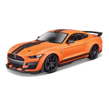 An orange Shelby Mustang sports car model with black racing stripes, black wheels, and a black rear spoiler, shown on a clean white background.