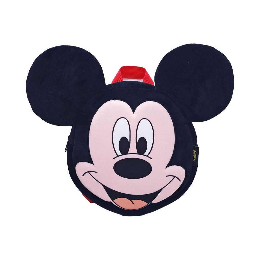 A Mickey Mouse-shaped backpack or bag with a round face design, featuring black ears, a pink face, black nose and outlines, and a small red top accent, shown on a plain white background.