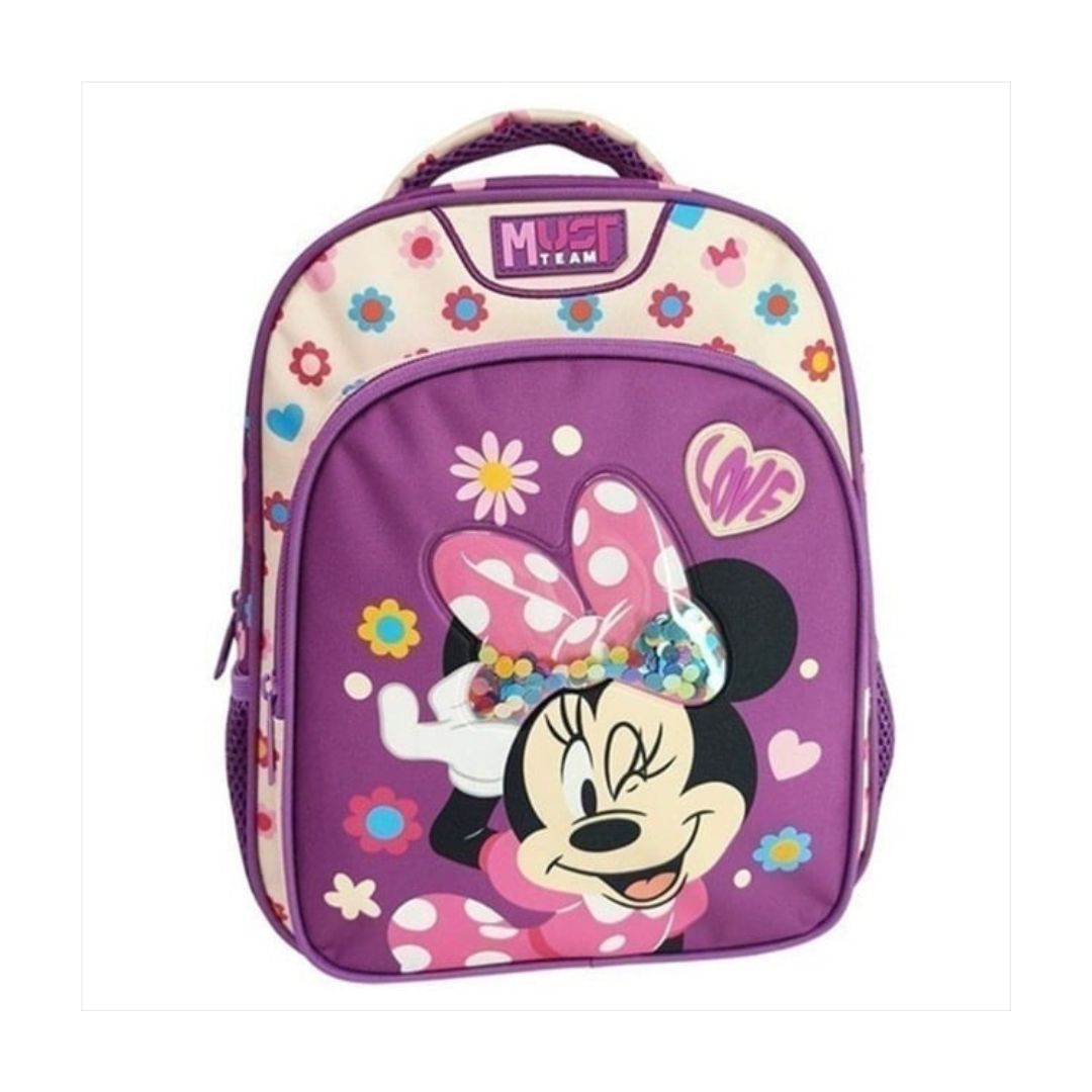 A purple school backpack featuring Minnie Mouse on the front, with a floral pattern on the top panel and a 'Must Team' logo patch. The backpack has a top carry handle, side mesh pockets, and a cartoon-style Minnie Mouse graphic with a pink polka-dot bow.