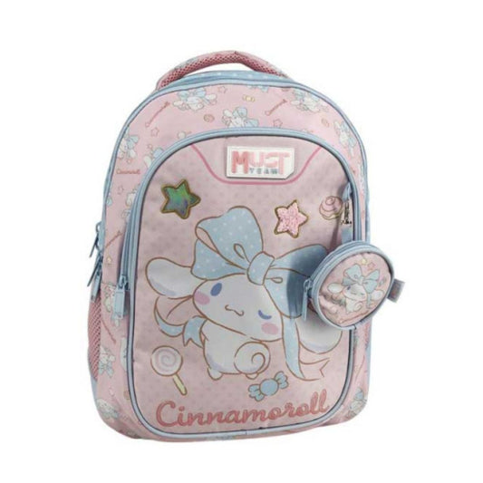 A pink Cinnamoroll school backpack with a matching zippered pouch, featuring a light blue bow design, pastel star and candy motifs, and a 'MUST TEAM' logo patch on the front.