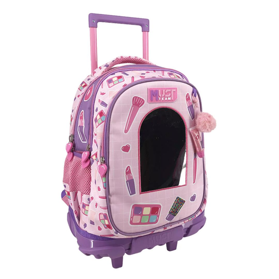 A pink and purple cosmetic-themed rolling backpack with a mirror, featuring makeup illustrations, a pink handle, and a fluffy pom-pom accent on a white background.