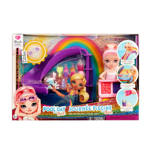 Blush Plush Pool Day toy set in its original window box packaging, featuring a doll with pink hair, a purple slide, a rainbow arch, and a small pool table setup.