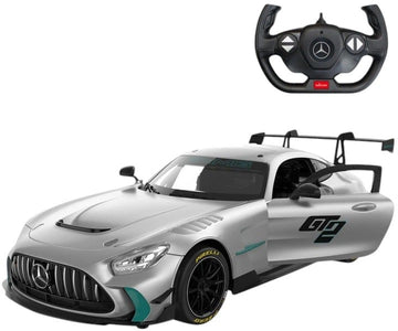 A silver Mercedes-AMG GT race car model with teal accents, shown alongside a black steering wheel controller with a Mercedes-Benz logo, on a plain white background.