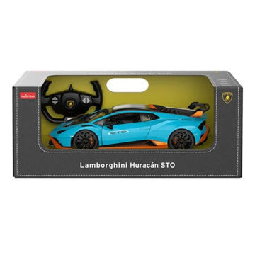 A toy Lamborghini Huracán STO diecast model car in its original packaging, featuring a bright blue car with orange accents and a black steering wheel controller inside a dark gray box.