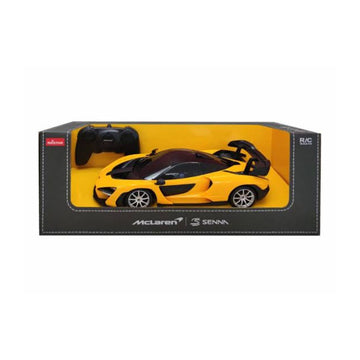 A yellow and black McLaren Senna RC model car in its original retail packaging, featuring a black remote control inside the box.