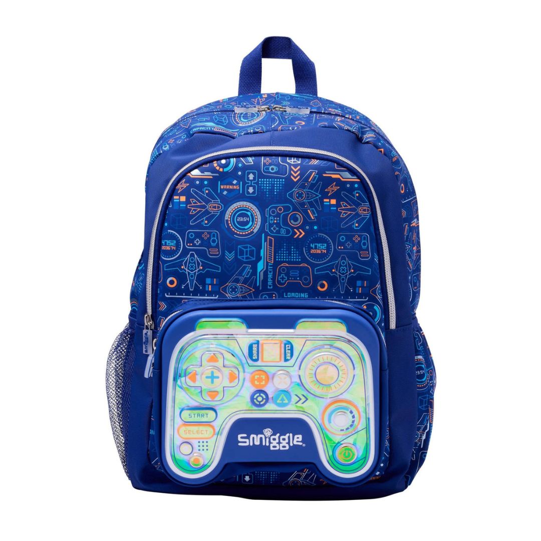 A blue Smiggle backpack featuring a retro video game controller design on the front pocket, with a matching blue patterned main body and side pockets, shown against a plain white background.