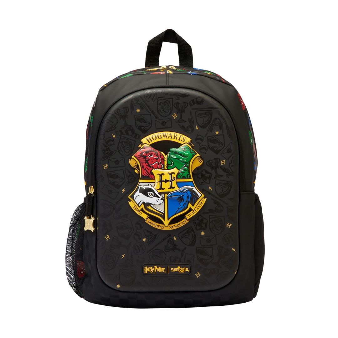A black backpack featuring the Hogwarts crest from Harry Potter on the front, with a subtle embossed pattern, gold stars, and colorful details on the top and sides.