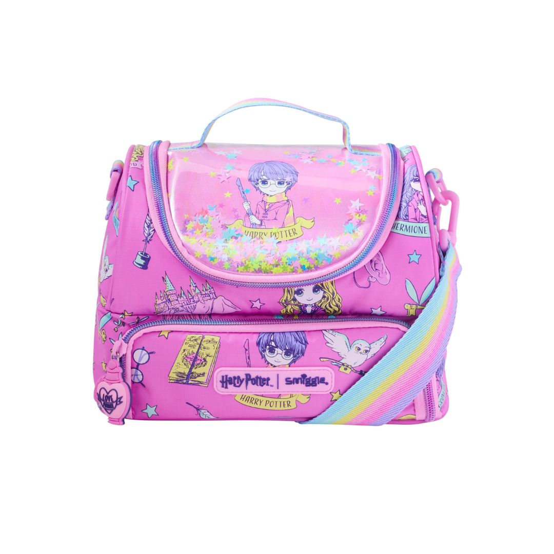 A pink Harry Potter themed lunch bag featuring colorful character prints, a clear top pocket, and a rainbow-colored shoulder strap on a white background.