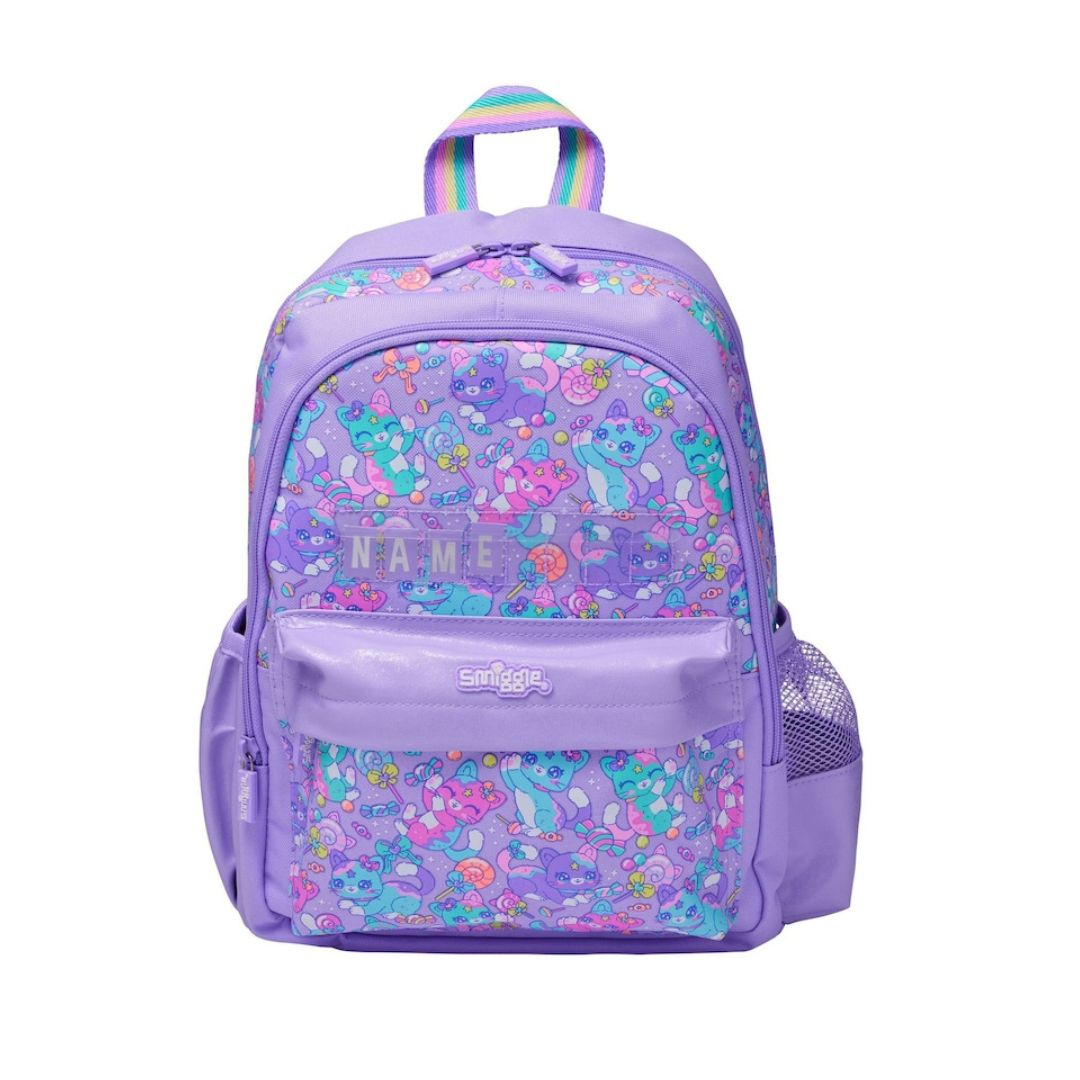 A purple backpack featuring a colorful cartoon character pattern on the main body and front pocket, with a rainbow-colored top handle and a clear side mesh pocket, shown on a plain white background.