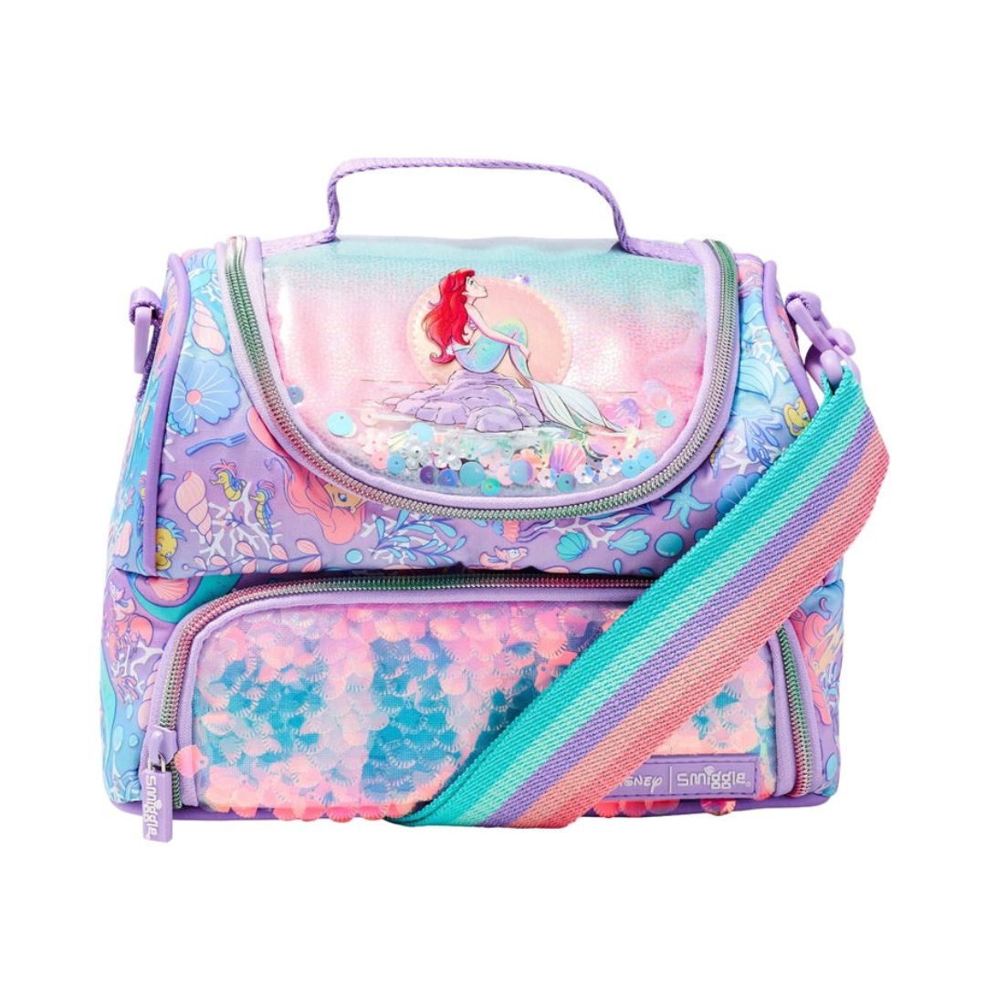 A Disney-themed lunch bag featuring Ariel the mermaid on the front flap, decorated with a pastel multicolor mermaid-themed pattern and a rainbow-striped shoulder strap, set against a plain white background.