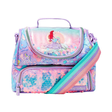 A Disney-themed lunch bag featuring Ariel the mermaid on the front flap, decorated with a pastel multicolor mermaid-themed pattern and a rainbow-striped shoulder strap, set against a plain white background.