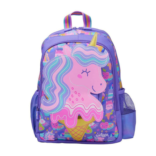 A purple kids' backpack featuring a large pink unicorn ice cream cone graphic on the front pocket, surrounded by pastel dessert illustrations. The backpack has a top handle, side mesh pockets, and a colorful rainbow strap.