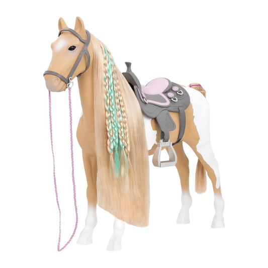A toy horse figurine with a tan and white coat, featuring a long blonde mane with mint green and lavender braids, a gray bridle, and a pink and gray saddle, shown on a plain white background.