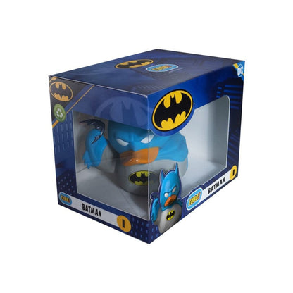 A Batman-themed novelty toilet paper holder in its original retail packaging. The product features a blue and gray body with a yellow bat logo, visible through a clear plastic window on a dark blue box decorated with Batman logos.