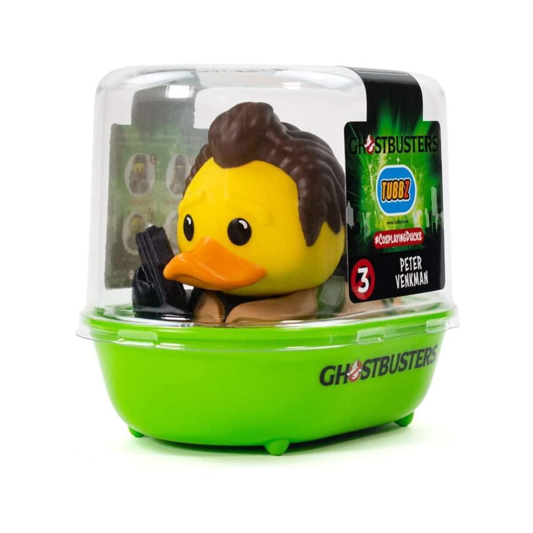 A Ghostbusters collectible rubber duck toy of Peter Venkman, sealed in its original clear plastic dome packaging with a bright green base and a black character label.