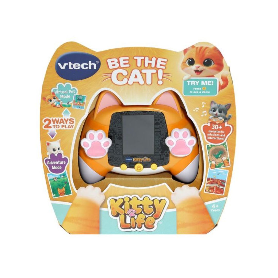 Vtech Kitty Life Be The Cat! electronic pet toy in its original retail packaging, featuring an orange cat-shaped handheld console with pink paw print accents.